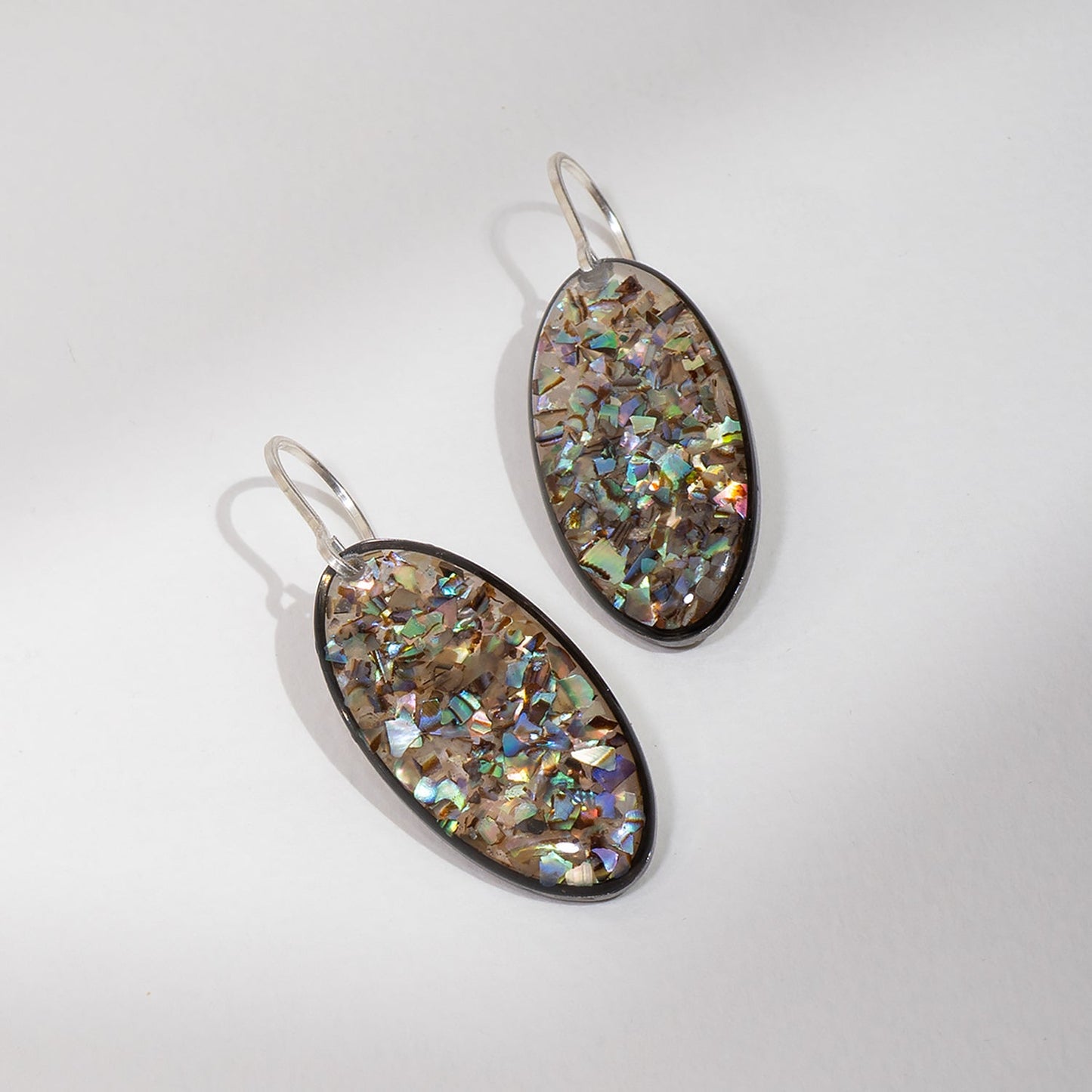 Luminous handcrafted oval earrings with genuine abalone shell in iridescent blue-green tones by Kate Koel