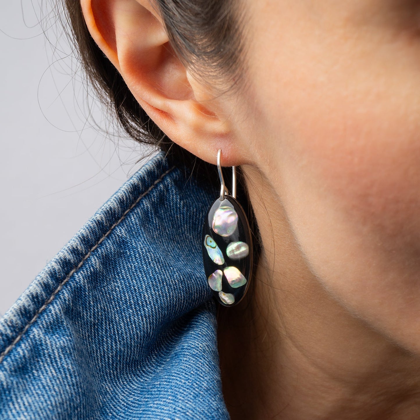 Midnight abalone shell oval drop earrings with genuine iridescent shell on dark background by Kate Koel