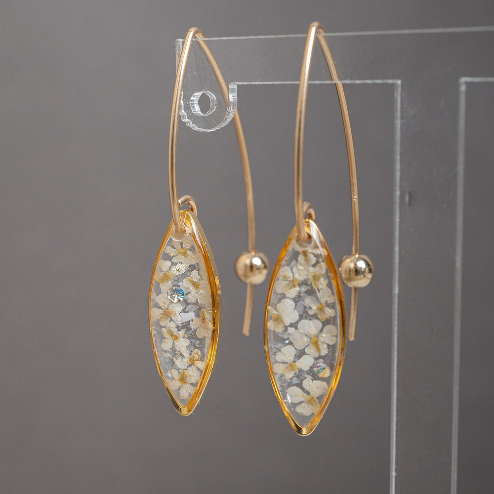 Delicate handcrafted minimalist flower dangle earrings in gold-filled metal by Kate Koel