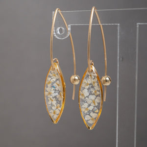 Delicate handcrafted minimalist flower dangle earrings in gold-filled metal by Kate Koel