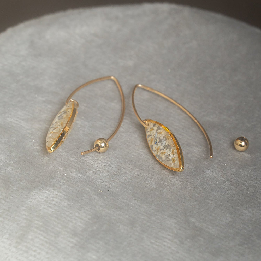 Delicate handcrafted minimalist flower dangle earrings in gold-filled metal by Kate Koel