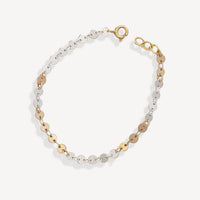 Bracelet with gold and silver chain links on a white background