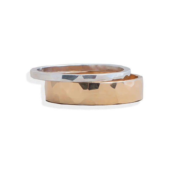 Two gold rings with different finishes on a white background
