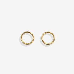 Pair of gold stud earrings on a white background