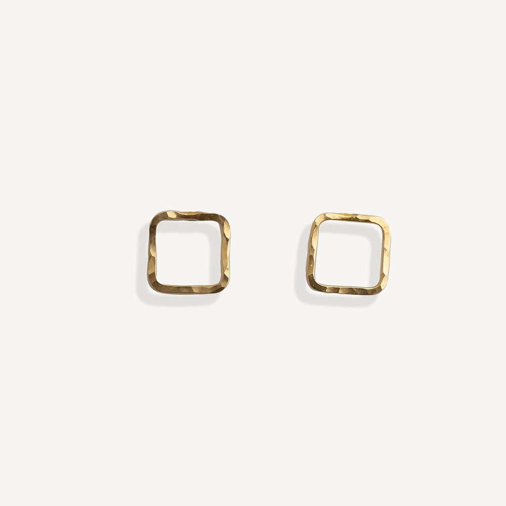 Gold square stud earrings on a white background