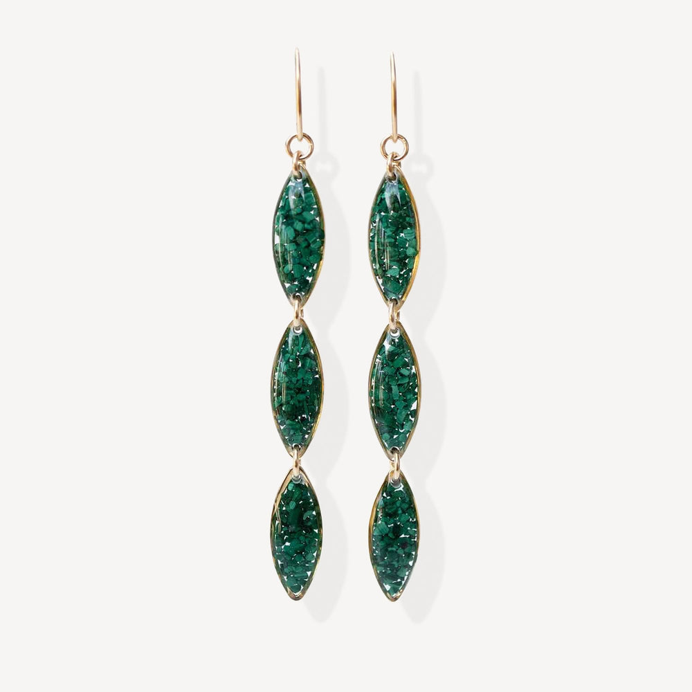 Green gemstone earrings on a white background