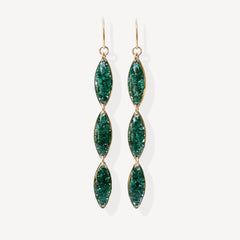 Green gemstone earrings on a white background