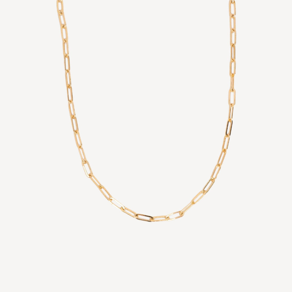 Gold chain necklace on a white background