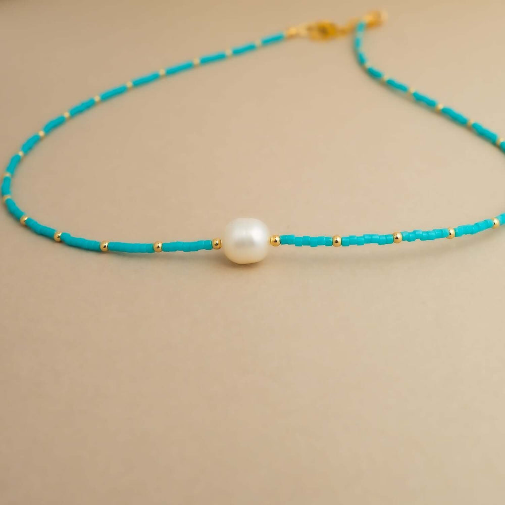 Handcrafted pearl turquoise beaded necklace with freshwater pearls and natural stones by Kate Koel