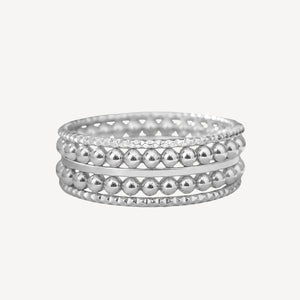 Silver hoop earrings with leaf design on a white background