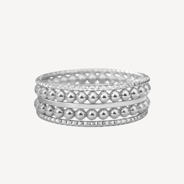 Silver hoop earrings with leaf design on a white background