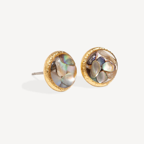 Pair of gold earrings with multicolored stone centers on a white background