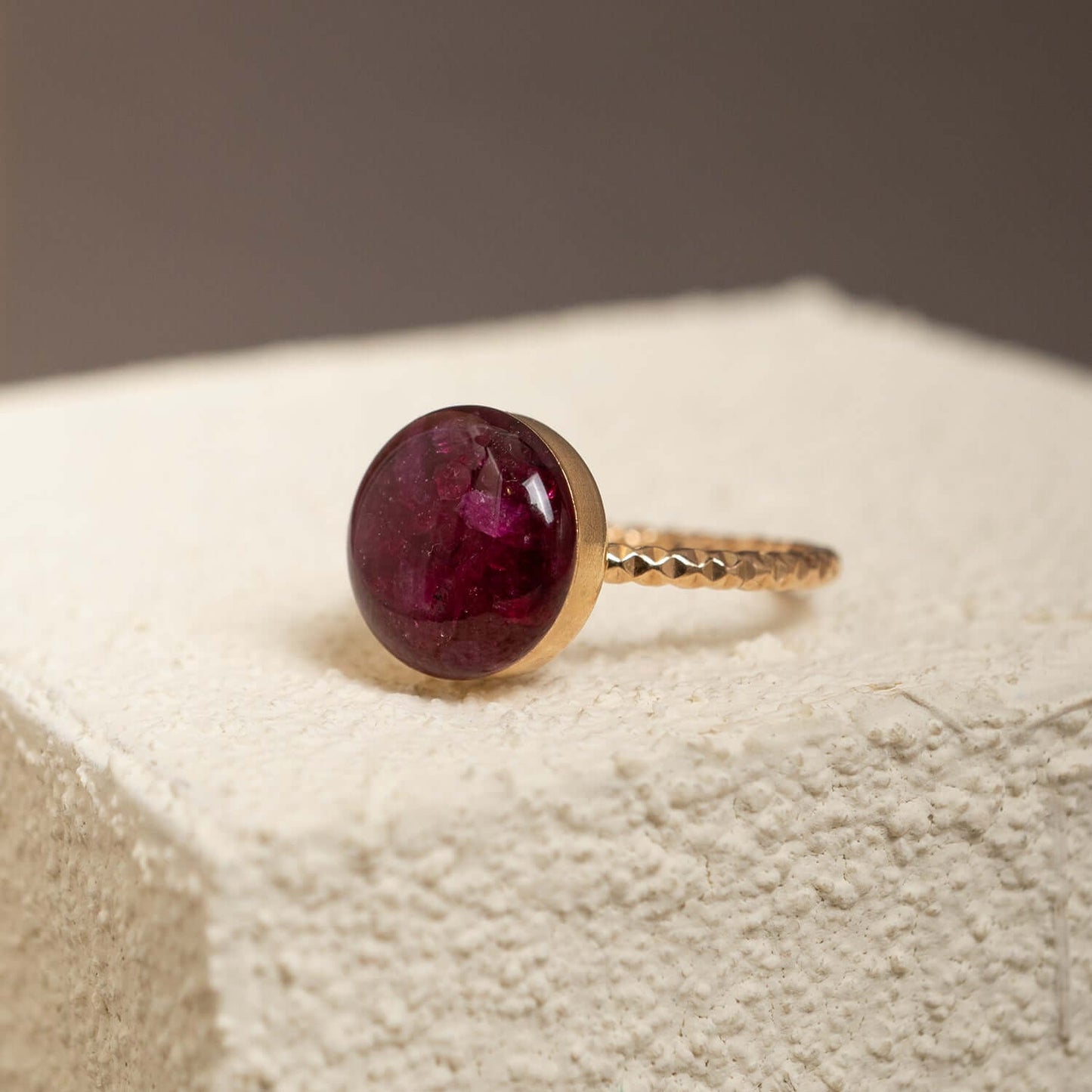 Handcrafted crushed ruby disco ring with sparkling red crushed stone inlay in gold-filled setting by Kate Koel