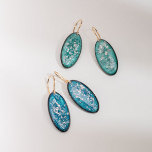 Handcrafted silver glow oval drop earrings with polished silver pendant and textured gold-filled ear wire by Kate Koel