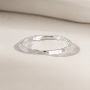 Silver ring on a beige background