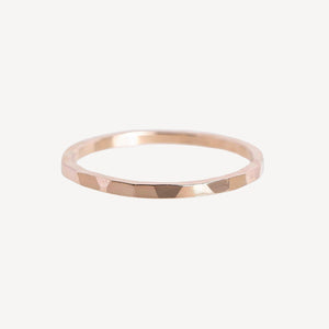 Rose gold ring on a white background