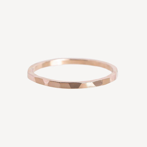 Rose gold ring on a white background