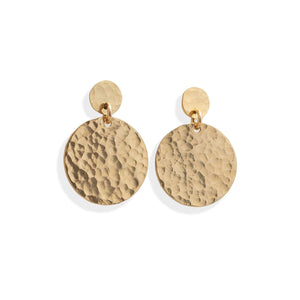 Gold earrings with a textured round design on a white background