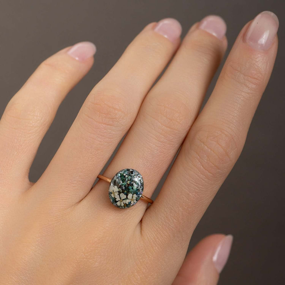 Handcrafted turquoise floral oval statement ring with hand-set stone and floral motif by Kate Koel