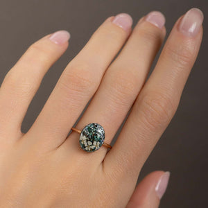 Handcrafted turquoise floral oval statement ring with hand-set stone and floral motif by Kate Koel