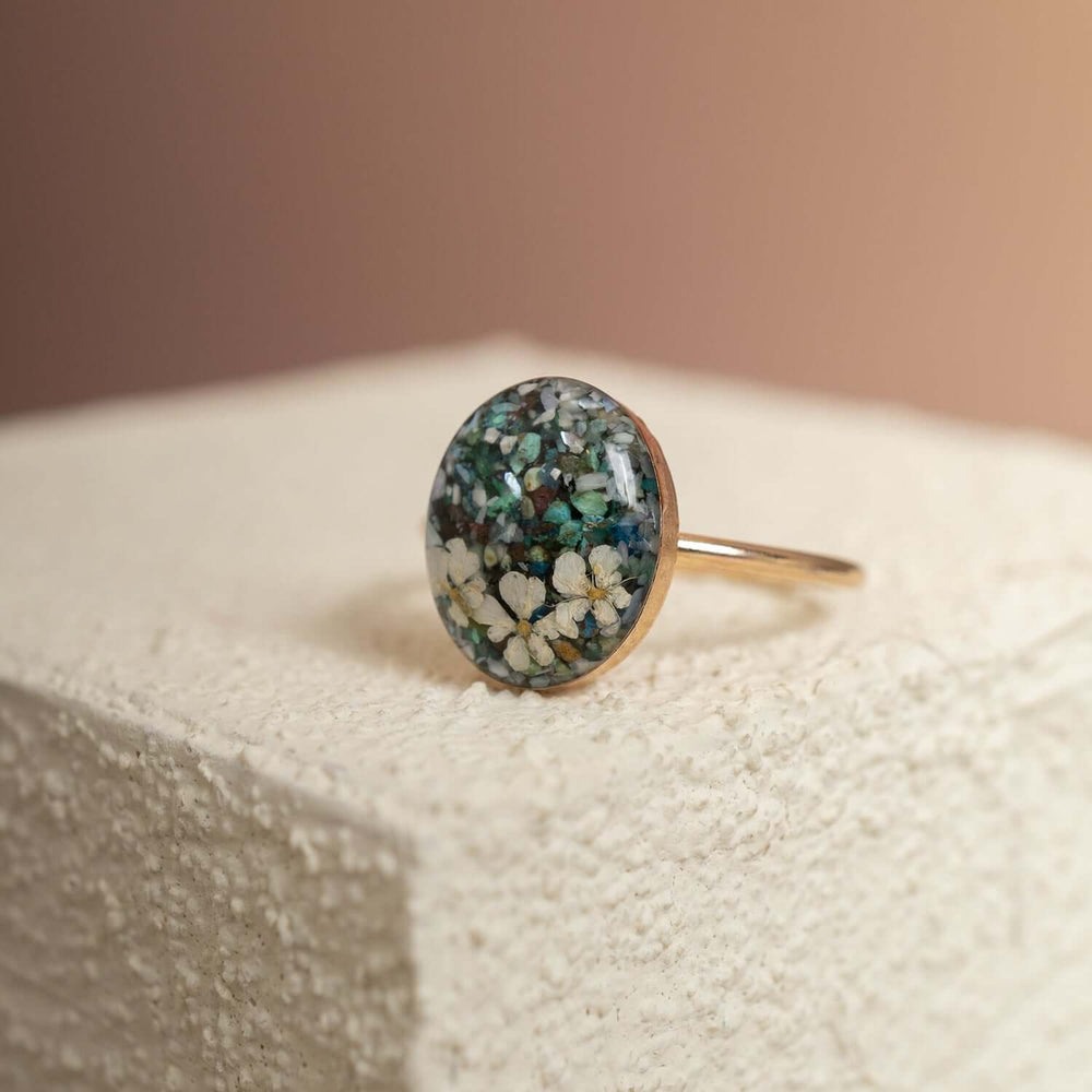 Handcrafted turquoise floral oval statement ring with hand-set stone and floral motif by Kate Koel