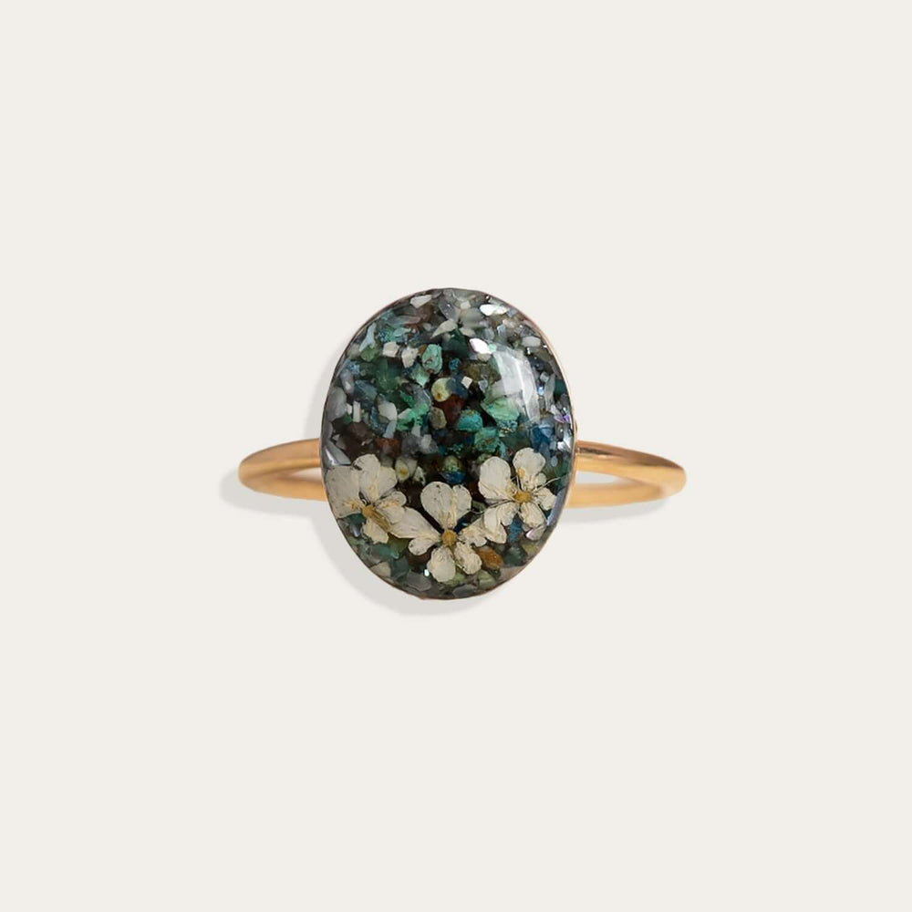 Handcrafted turquoise floral oval statement ring with hand-set stone and floral motif by Kate Koel
