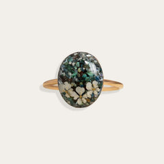 Handcrafted turquoise floral oval statement ring with hand-set stone and floral motif by Kate Koel