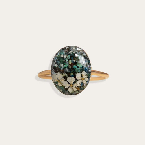 Handcrafted turquoise floral oval statement ring with hand-set stone and floral motif by Kate Koel