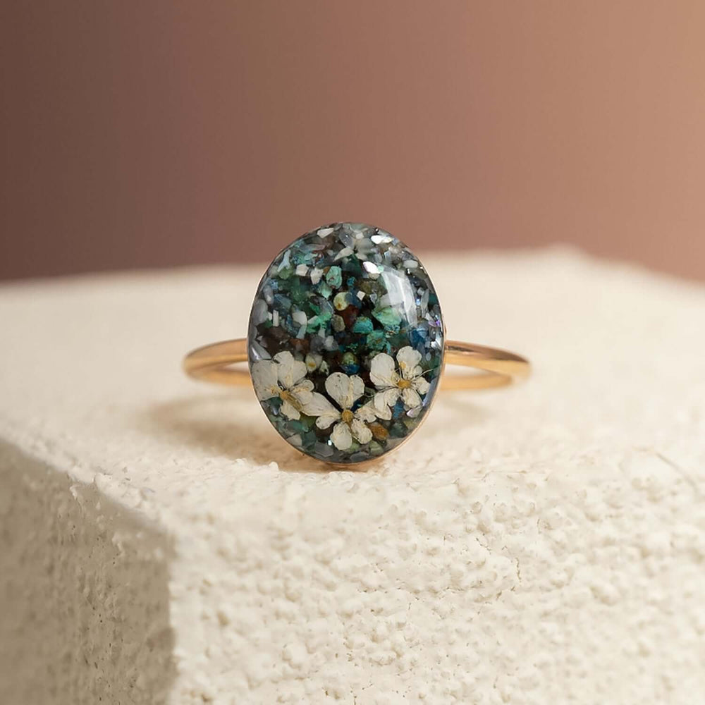 Handcrafted turquoise floral oval statement ring with hand-set stone and floral motif by Kate Koel