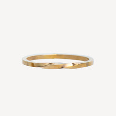 Gold stackable ring on a white background