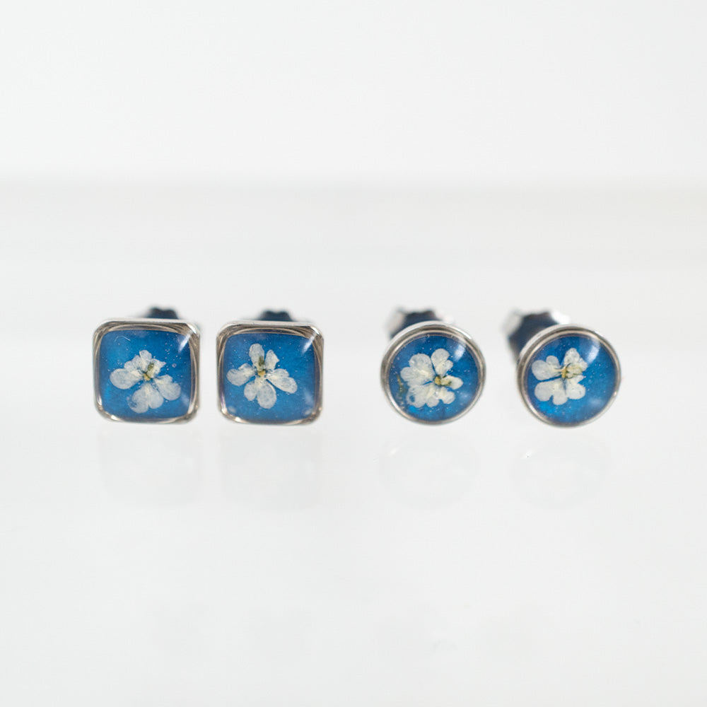 
                  
                    Blue flower earrings in silver
                  
                