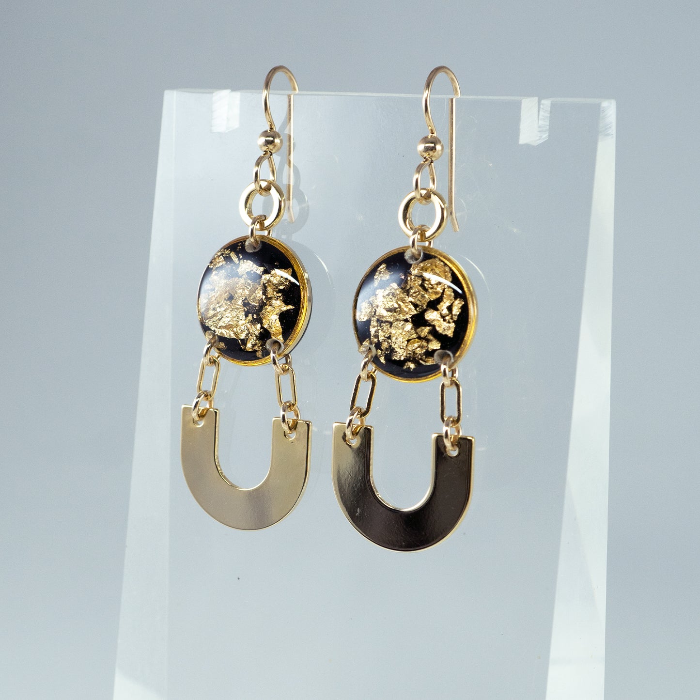 
                  
                    Dangling Black and Gold Earrings
                  
                