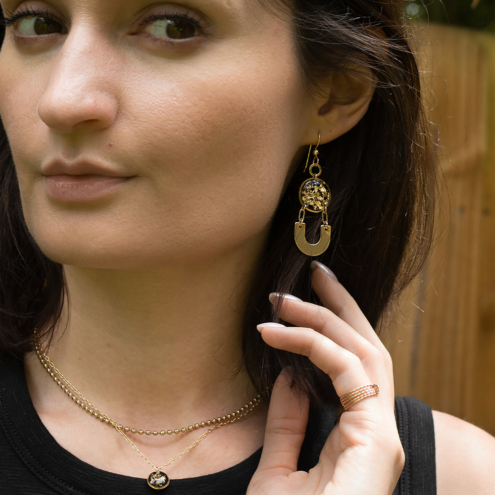 
                  
                    Dangling Black and Gold Earrings
                  
                
