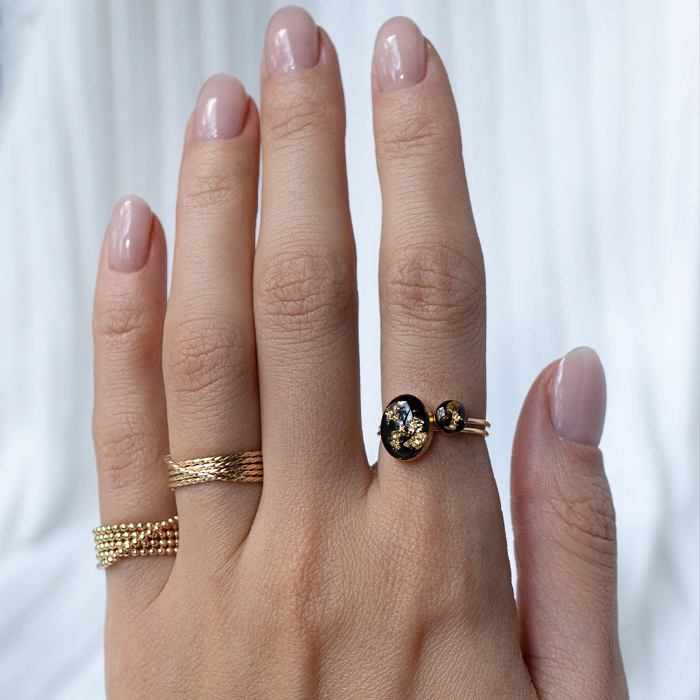
                      
                        Black and Gold Oval Ring
                      
                    